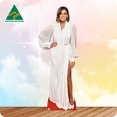 Woman in a white dress with a red bottom standing on a wooden floor with a colorful background and 'Australian Made' logo.